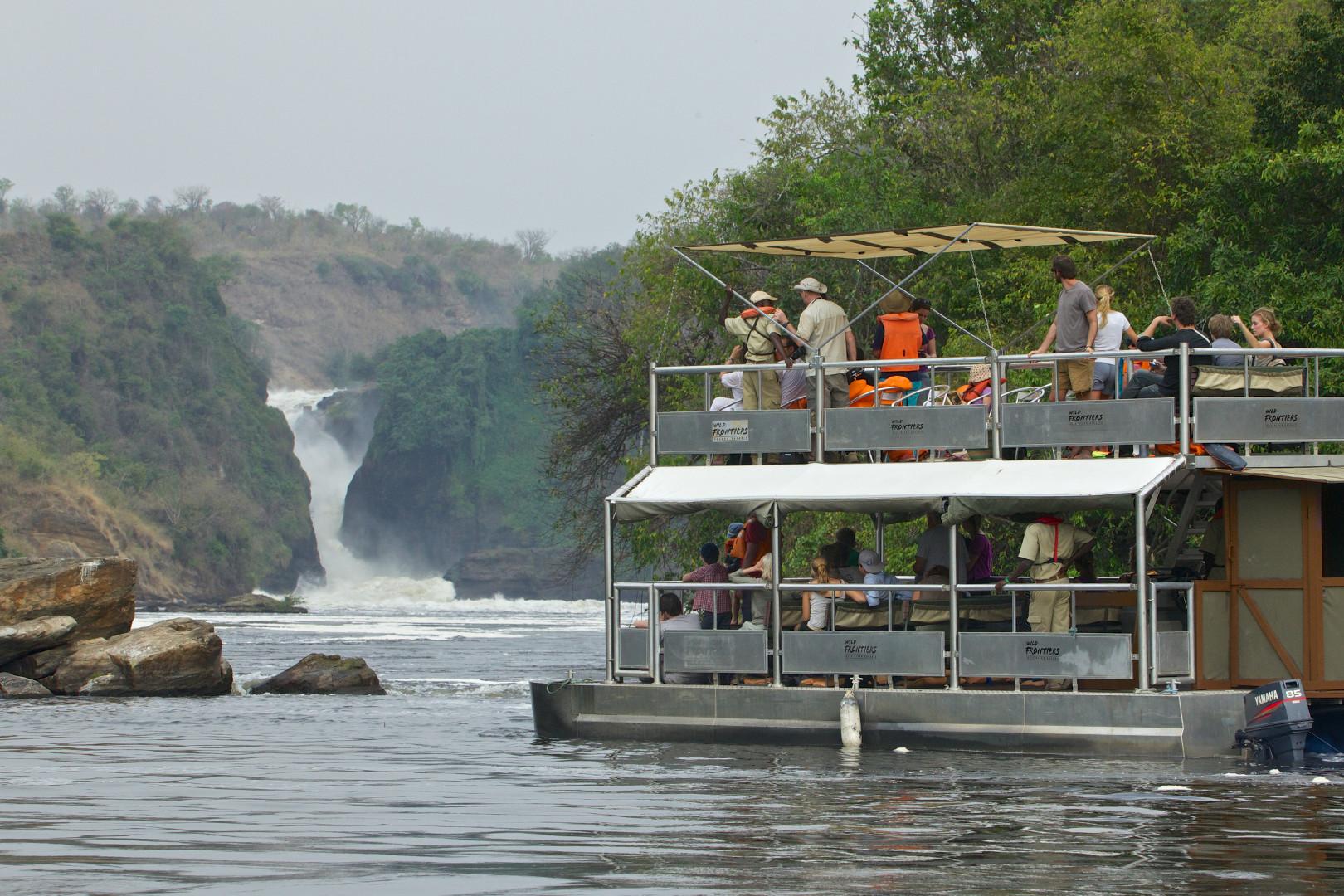 Day 7: Transfer to Kibale National Park, Crater Lakes, and Community Engagement
