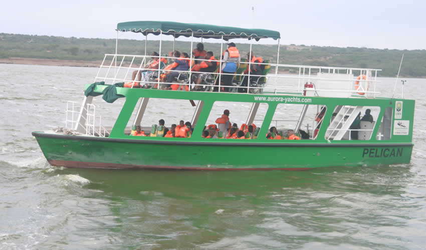 Day 3: Transfer to Queen Elizabeth National Park and Kazinga Channel Boat Cruise